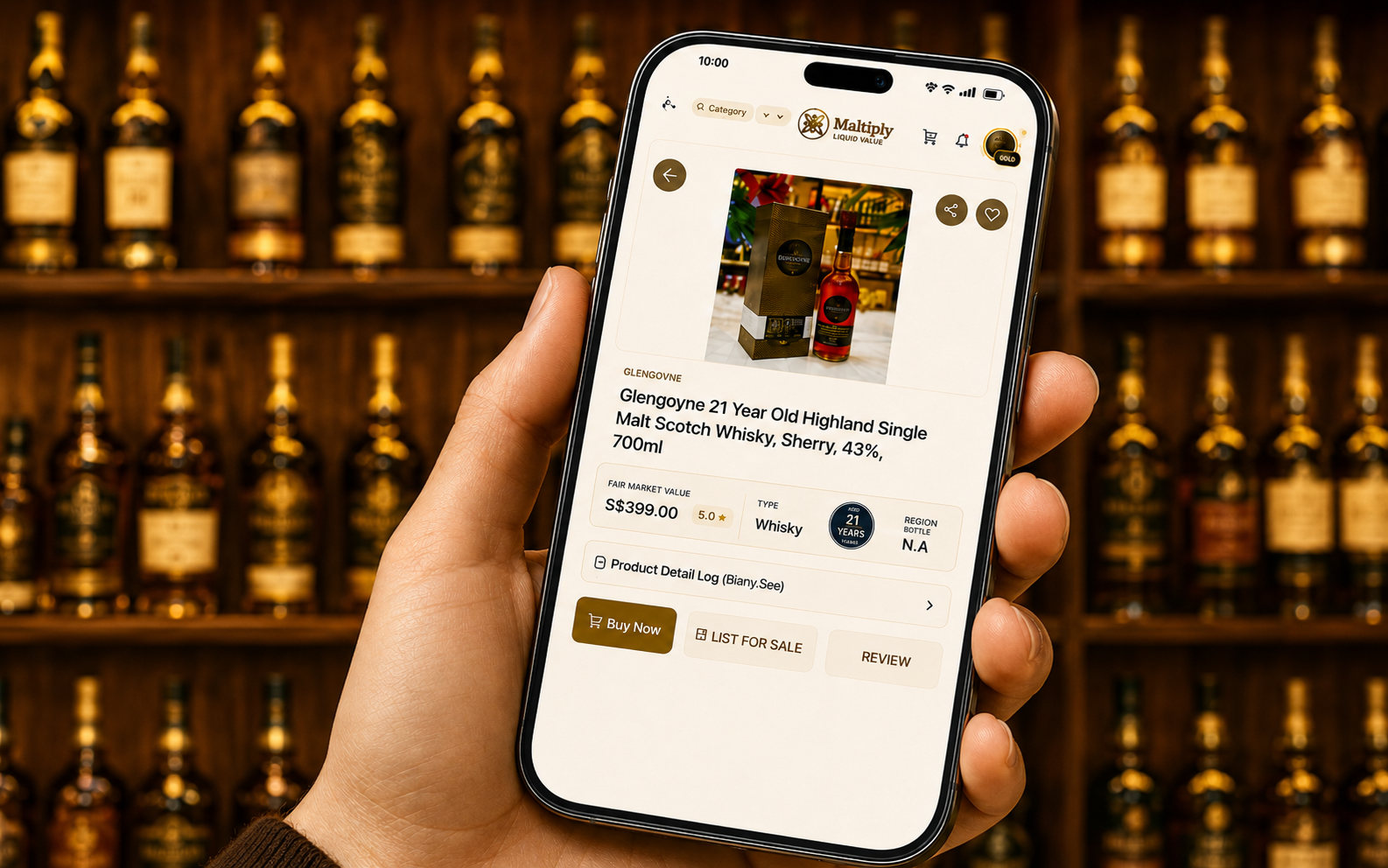 Maltiply whisky listing shown on a phone in front of a whisky collection